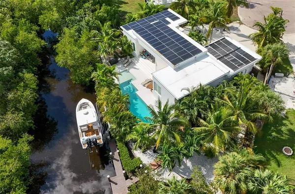 a kitchen with a sink a stove and a washer dryer