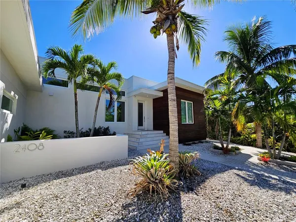 a bathroom with a sink a mirror and a shower