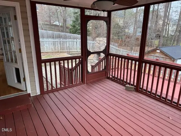 a view of a wooden balcony with wooden floor