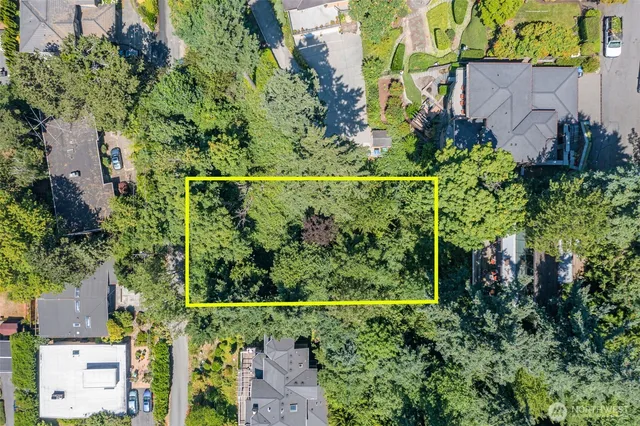 an aerial view of a house with a garden