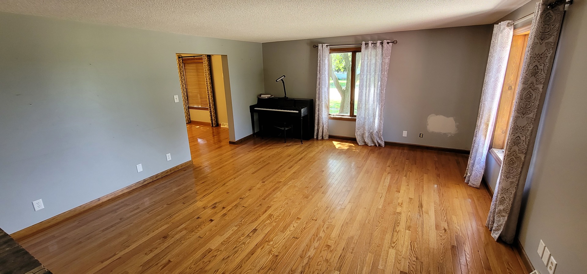 312 West Grove Road Sterling, IL 61081 - Photo 20 of 43 a view of a room with wooden floor and a window