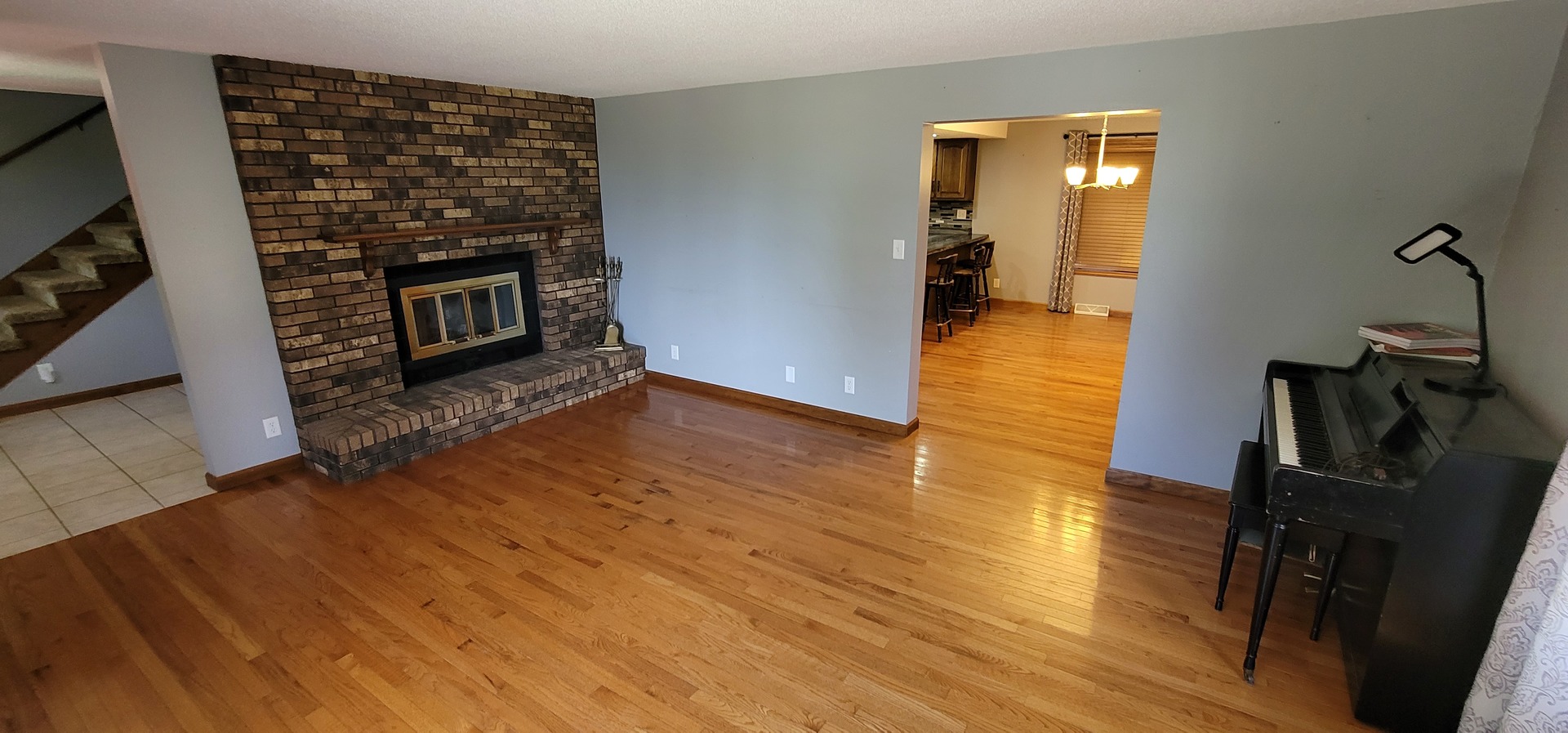 312 West Grove Road Sterling, IL 61081 - Photo 21 of 43 a view of a livingroom with wooden floor and a fireplace