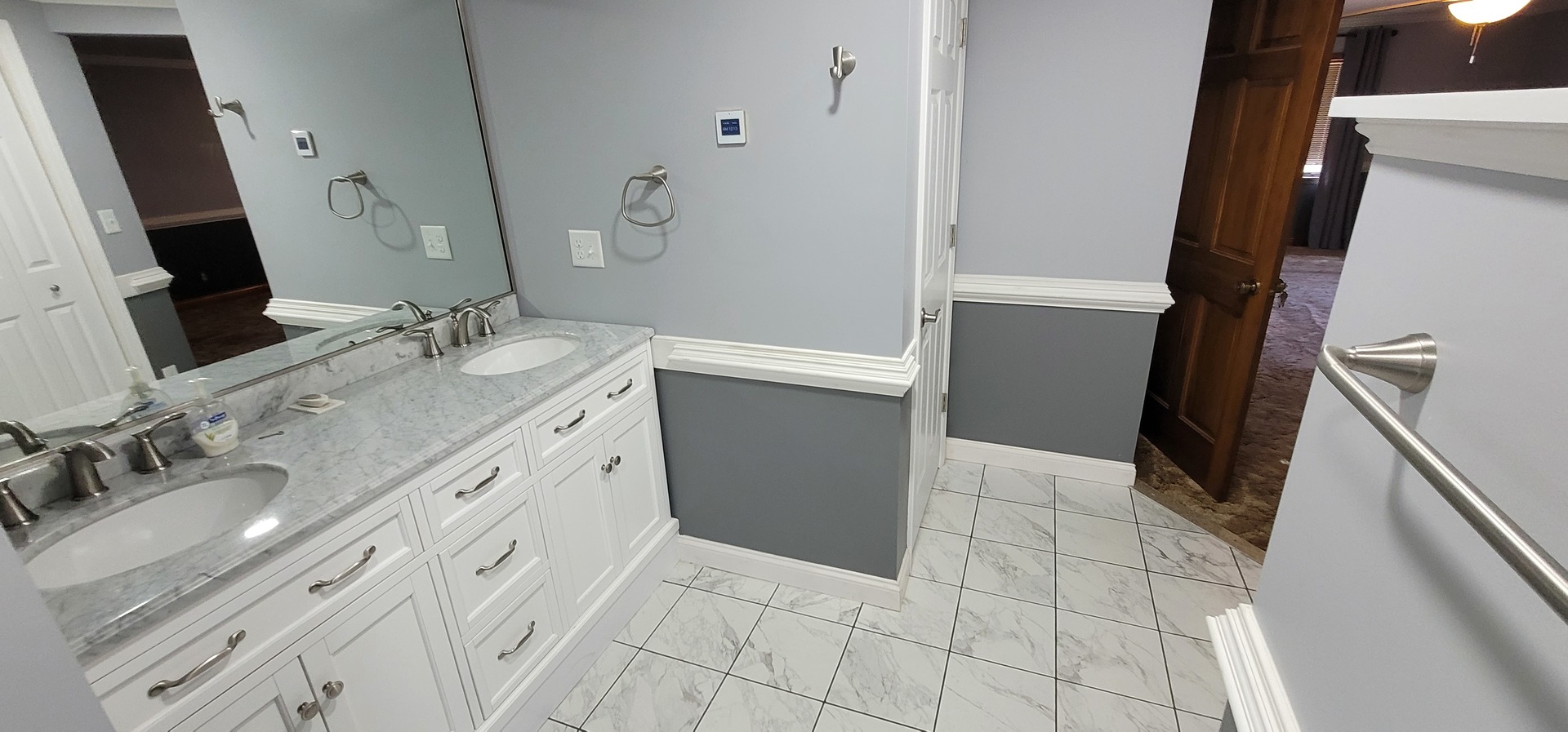312 West Grove Road Sterling, IL 61081 - Photo 25 of 43 a bathroom with a sink and a mirror