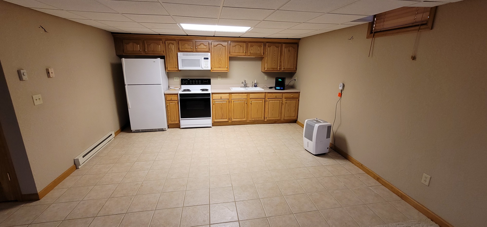 312 West Grove Road Sterling, IL 61081 - Photo 36 of 43 a kitchen with refrigerator and cabinets