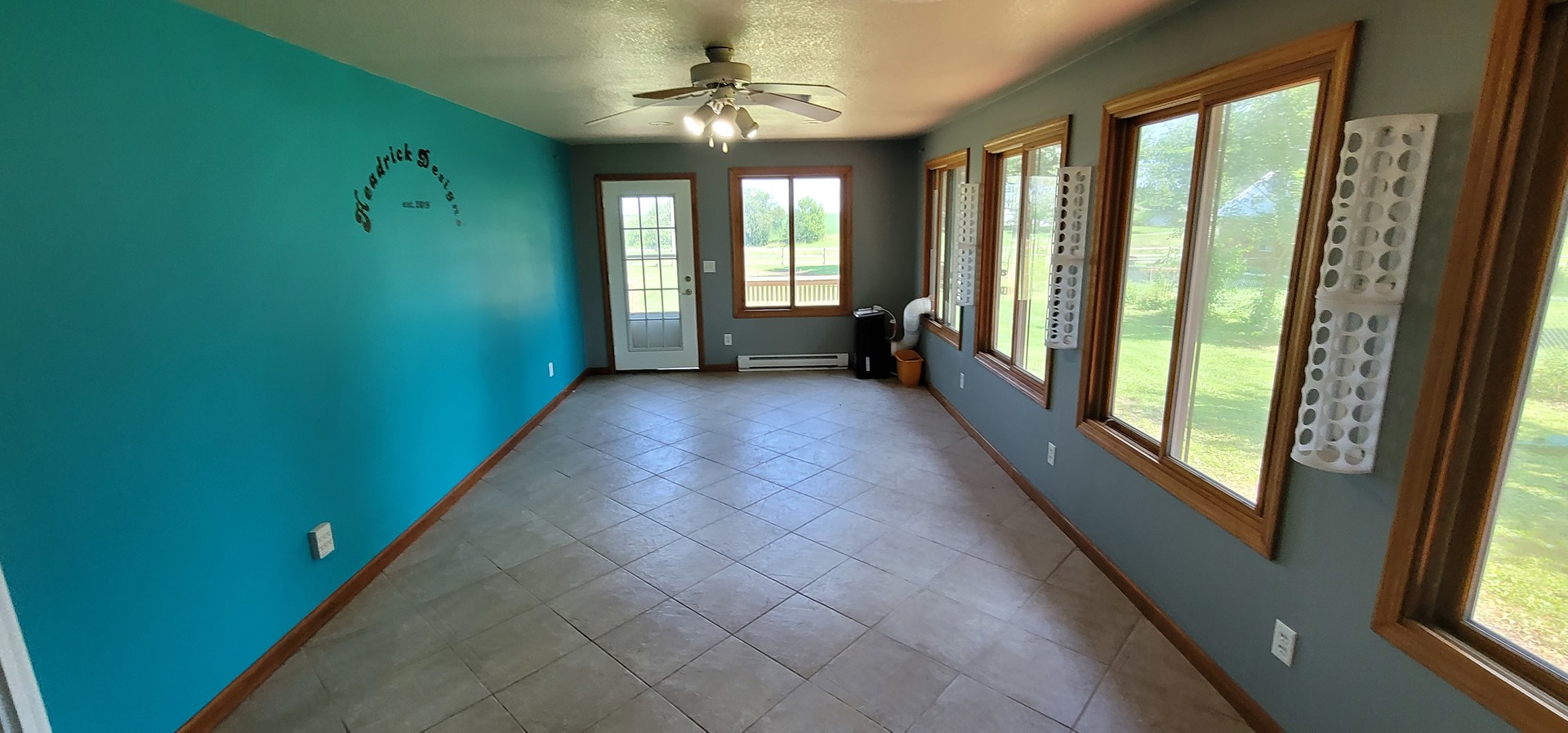 312 West Grove Road Sterling, IL 61081 - Photo 8 of 43 a view of a room with large windows and stairs