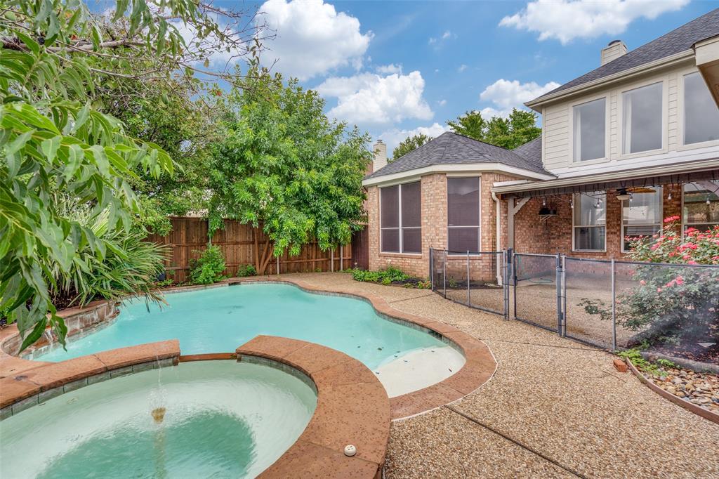 3421 Neiman Road Plano, TX 75025 - Photo 35 of 40 View of pool featuring a fenced backyard, a pool with connected hot tub, a gate, and a patio area