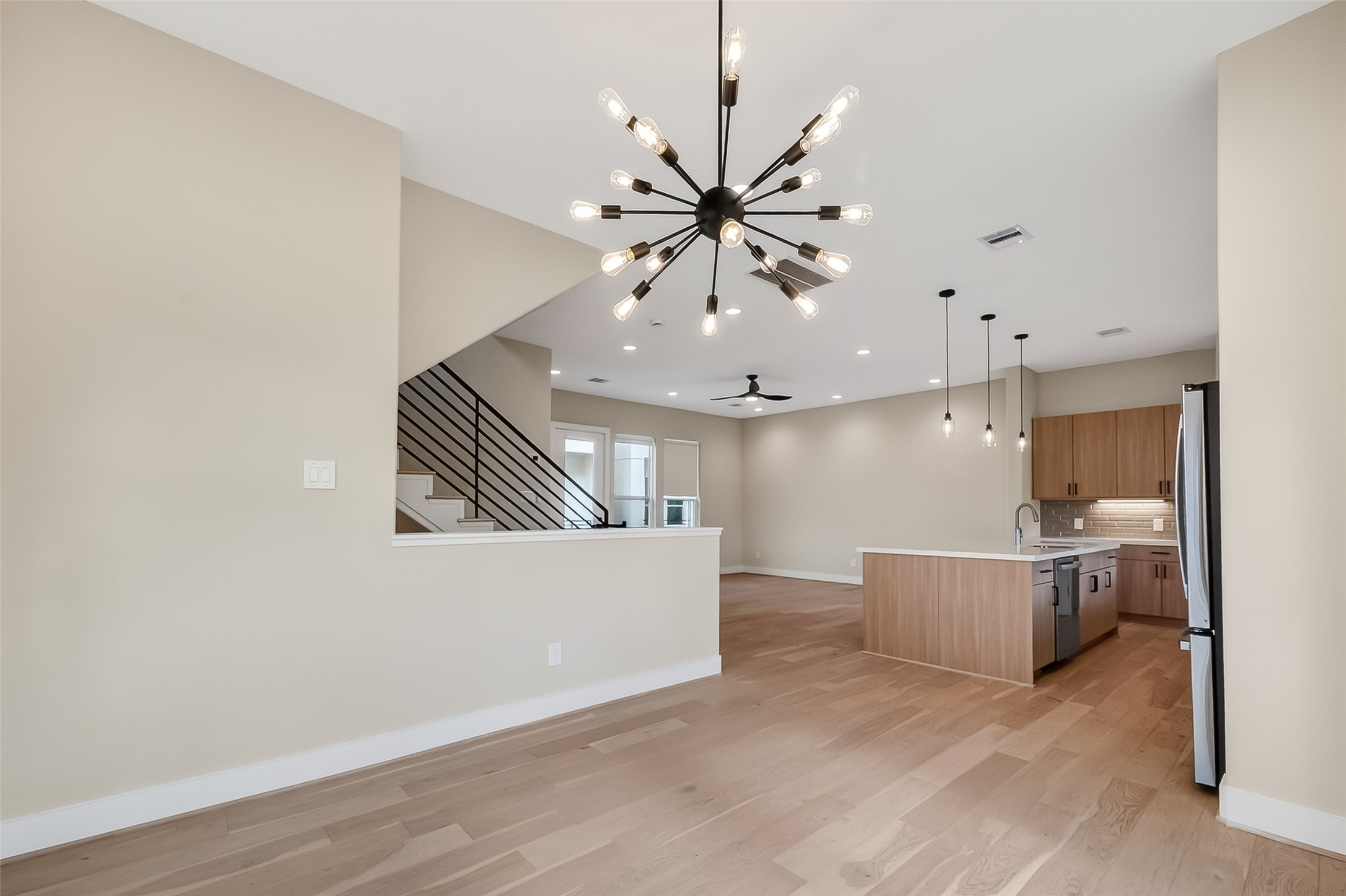 2511 North MacGregor Way Houston, TX 77004 - Photo 17 of 42 a living room with furniture and a chandelier