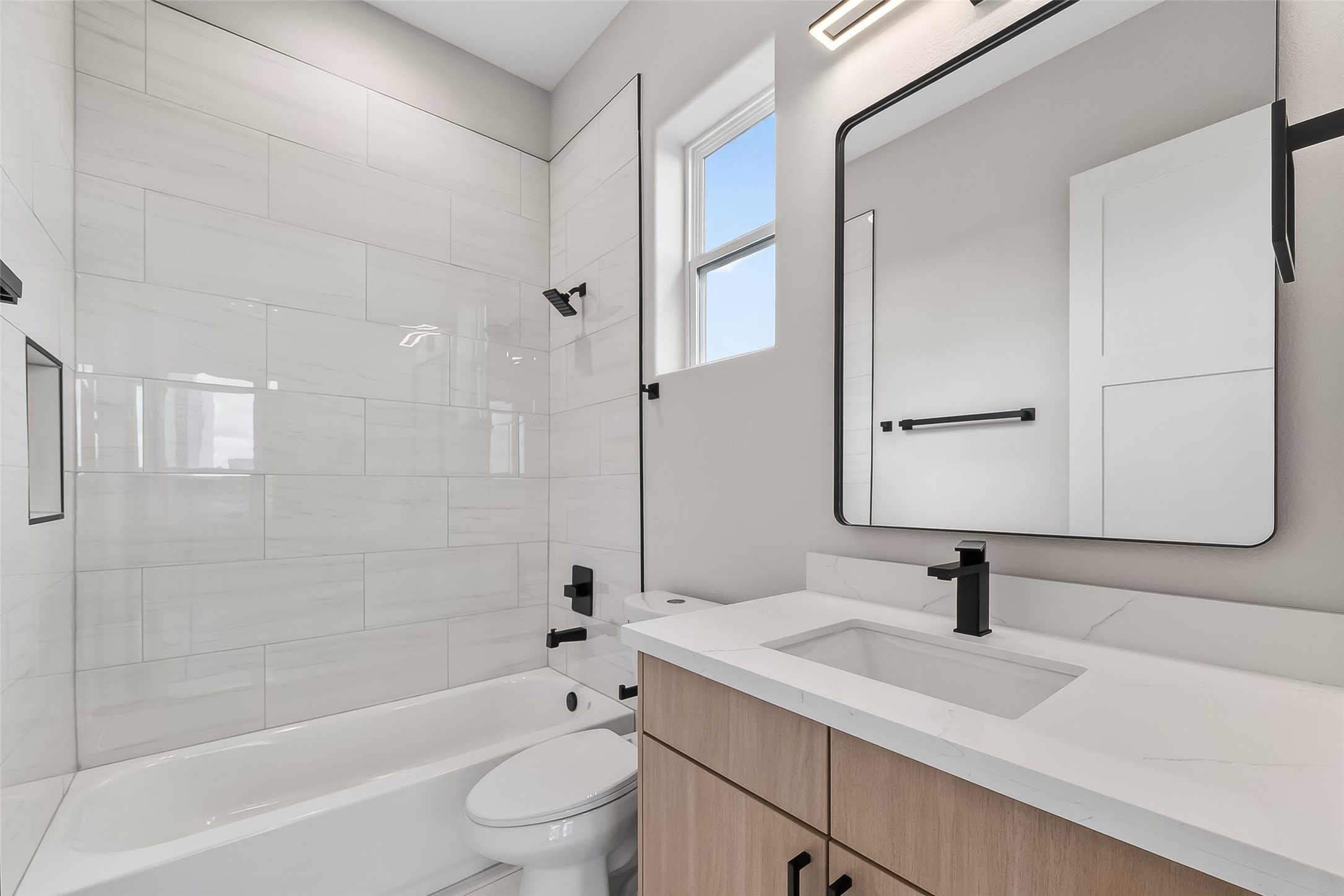 2511 North MacGregor Way Houston, TX 77004 - Photo 30 of 42 a bathroom with a sink a toilet and shower