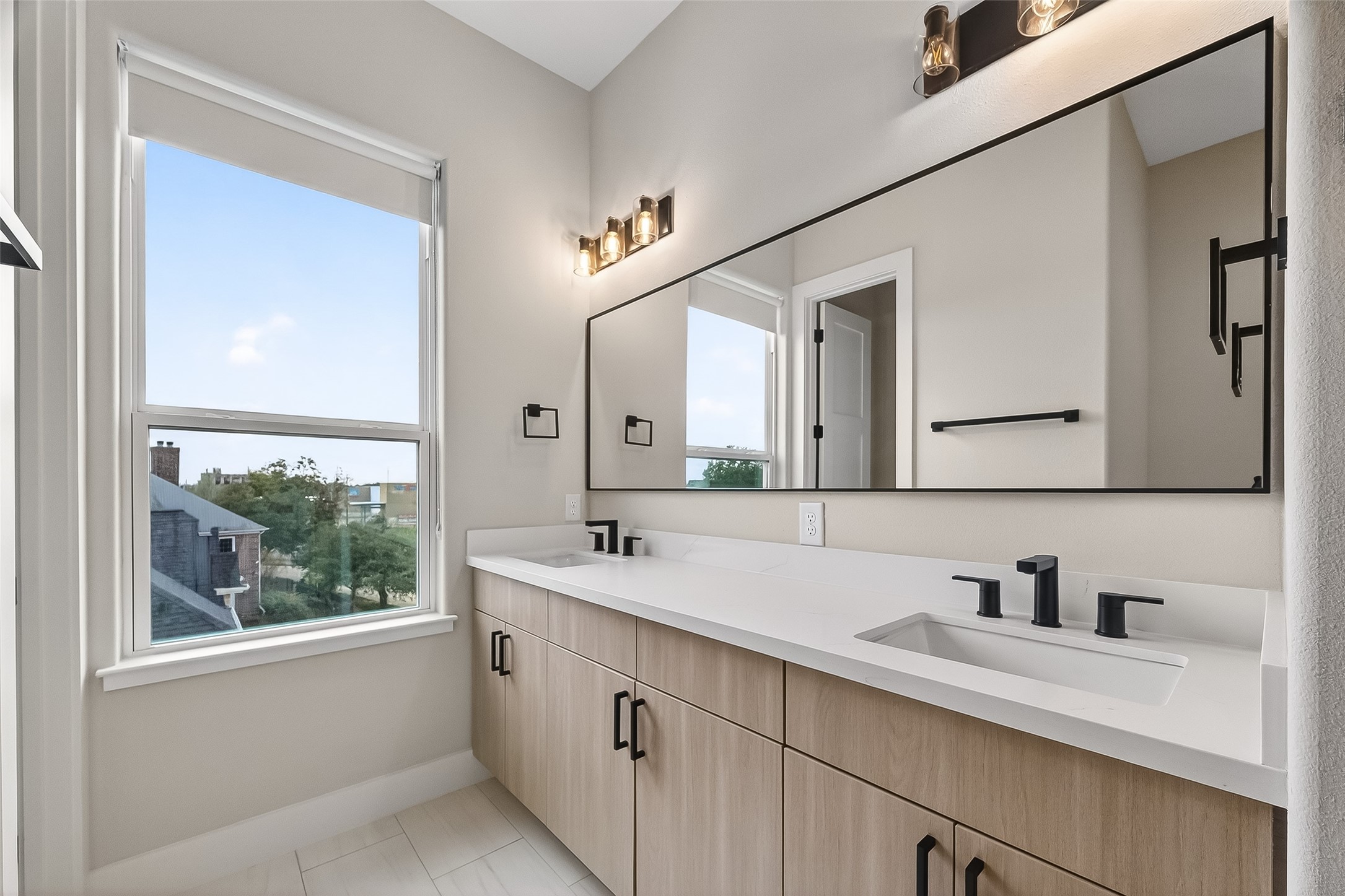 2511 North MacGregor Way Houston, TX 77004 - Photo 39 of 42 a bathroom with a sink and a mirror
