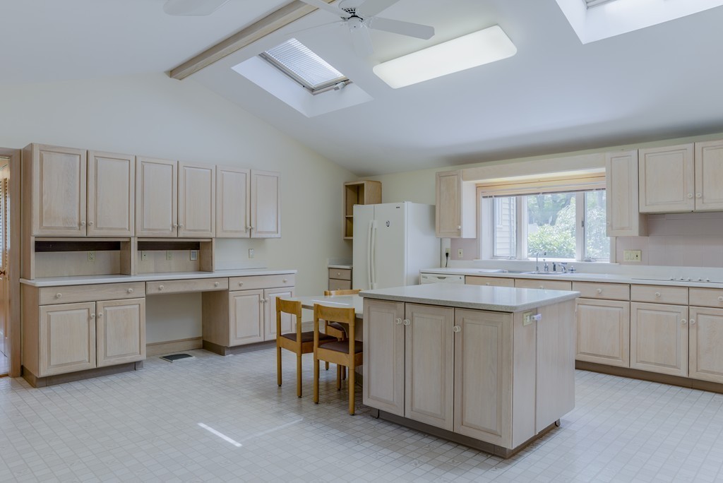 16 Audubon Road Lexington, MA 02421 - Photo 11 of 30 a kitchen with white cabinets and sink