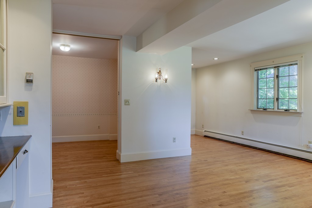 16 Audubon Road Lexington, MA 02421 - Photo 15 of 30 an empty room with wooden floor and windows