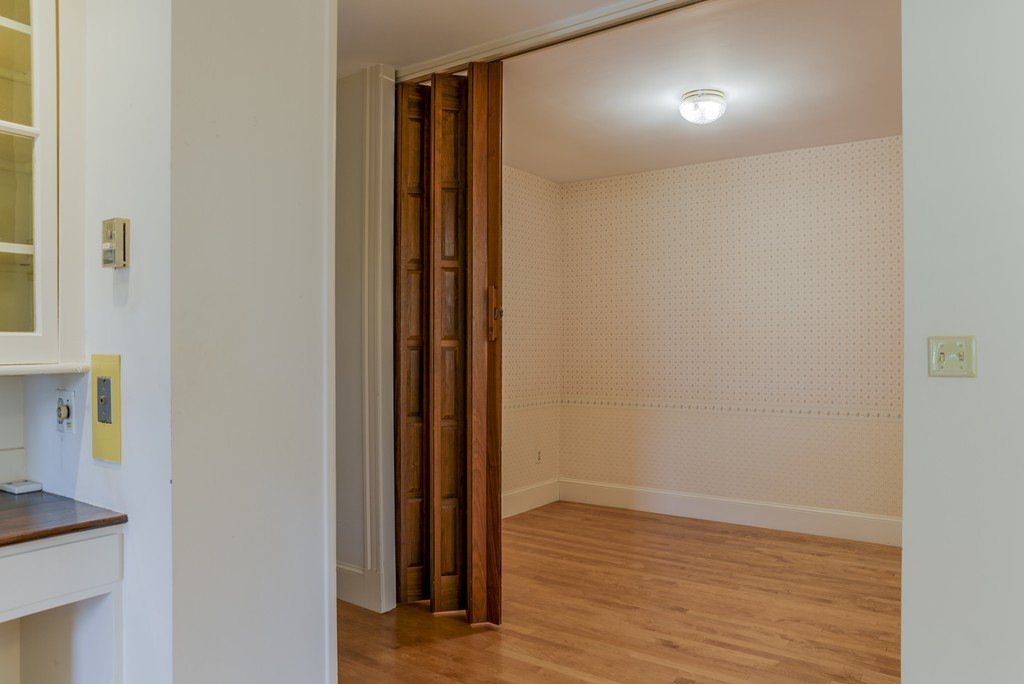 16 Audubon Road Lexington, MA 02421 - Photo 16 of 30 a view of hallway with wooden floor