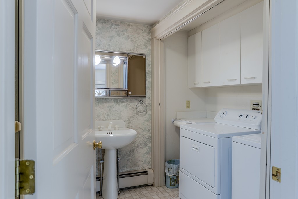 16 Audubon Road Lexington, MA 02421 - Photo 17 of 30 a bathroom with a sink a mirror and a toilet