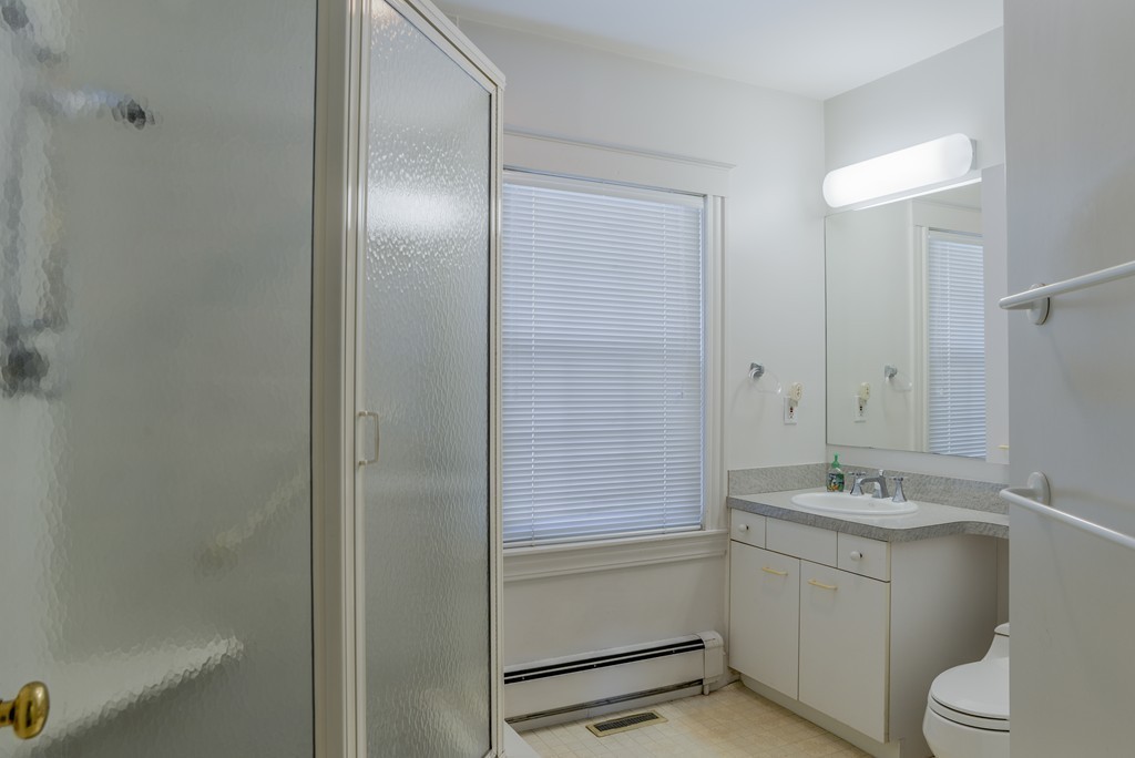 16 Audubon Road Lexington, MA 02421 - Photo 26 of 30 a bathroom with a sink a toilet and shower