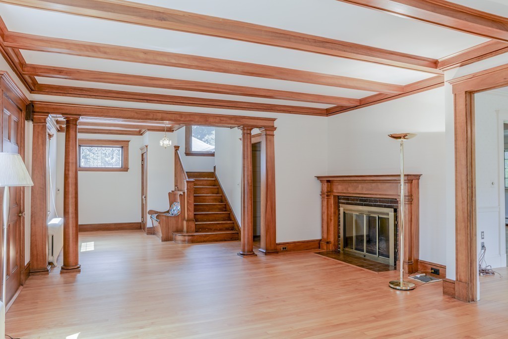16 Audubon Road Lexington, MA 02421 - Photo 8 of 30 a view of an entryway with wooden floor and a fireplace