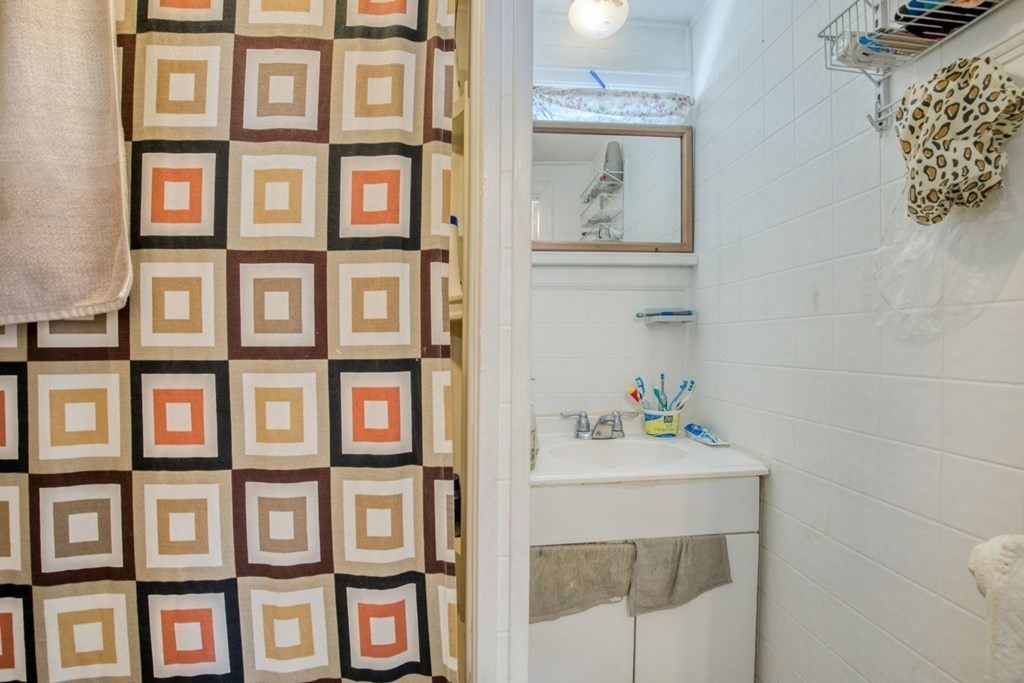 30 Adams Street Springfield, MA 01105 - Photo 11 of 23 a bathroom with a sink and a window