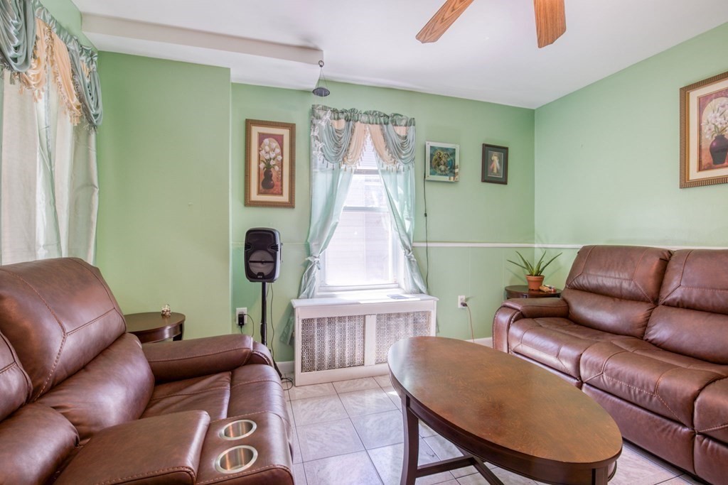 30 Adams Street Springfield, MA 01105 - Photo 13 of 23 a living room with furniture and a window