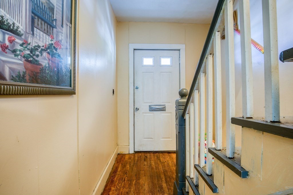 30 Adams Street Springfield, MA 01105 - Photo 18 of 23 a view of a hallway with wooden floor and staircase