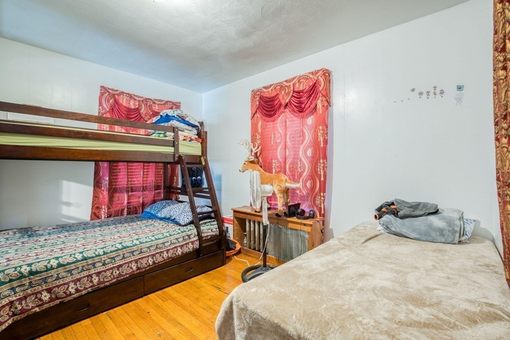 30 Adams Street Springfield, MA 01105 - Photo 8 of 23 a bedroom with a bed and dresser