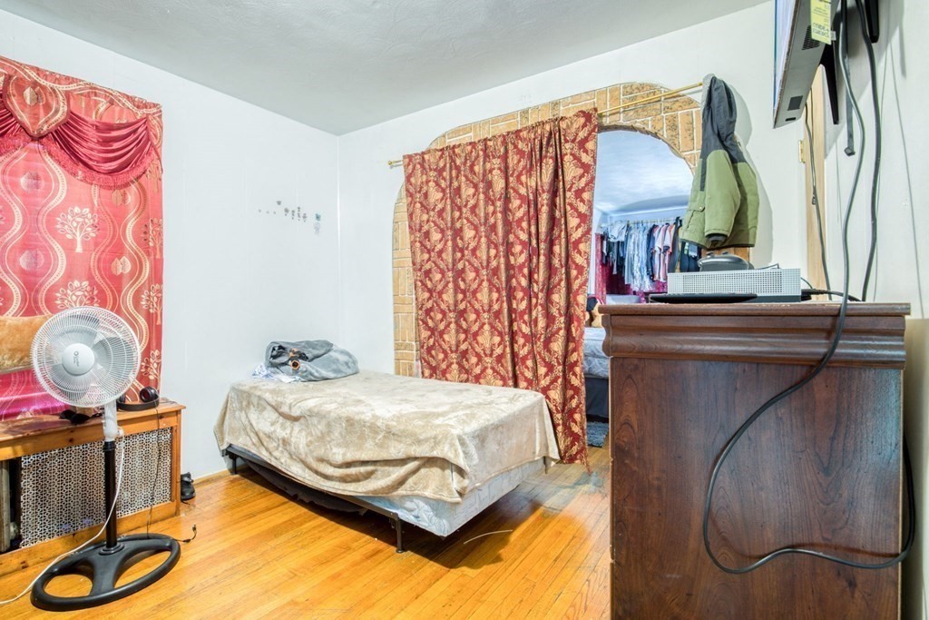 30 Adams Street Springfield, MA 01105 - Photo 9 of 23 a bedroom with a bed and dresser