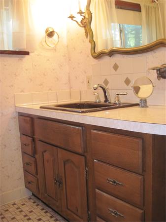 12 Eaton Road Framingham, MA 01701 - Photo 16 of 29 a bathroom with a sink and a mirror