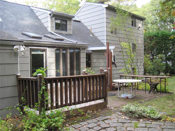 12 Eaton Road Framingham, MA 01701 - Photo 25 of 29 a view of a chair with a house in the background