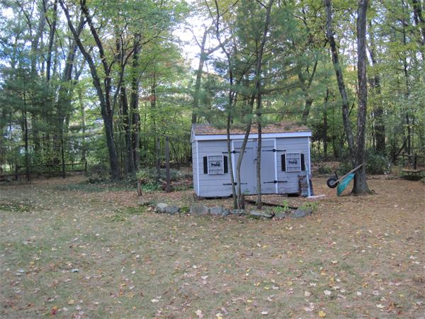 12 Eaton Road Framingham, MA 01701 - Photo 26 of 29 a view of a barn in the middle of a forest