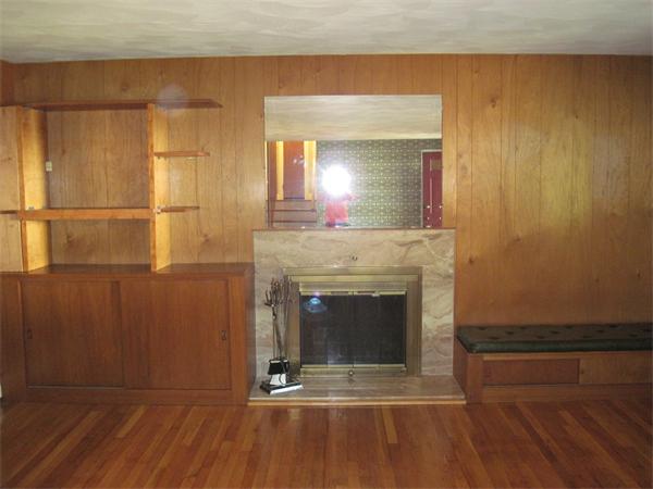 12 Eaton Road Framingham, MA 01701 - Photo 3 of 29 a room with a fireplace