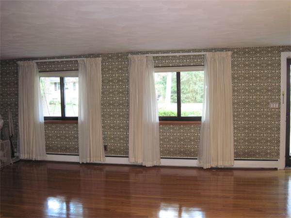 12 Eaton Road Framingham, MA 01701 - Photo 5 of 29 a view of an empty room with wooden floor and a window