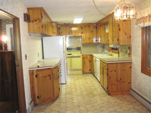 12 Eaton Road Framingham, MA 01701 - Photo 8 of 29 a kitchen with a sink refrigerator and cabinets