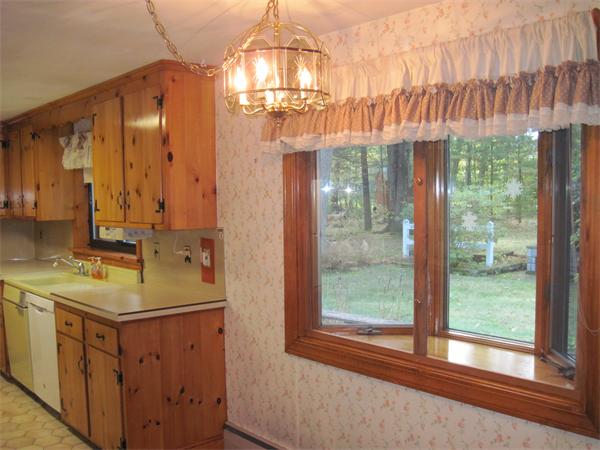 12 Eaton Road Framingham, MA 01701 - Photo 10 of 29 a bathroom with a sink a mirror and a shower