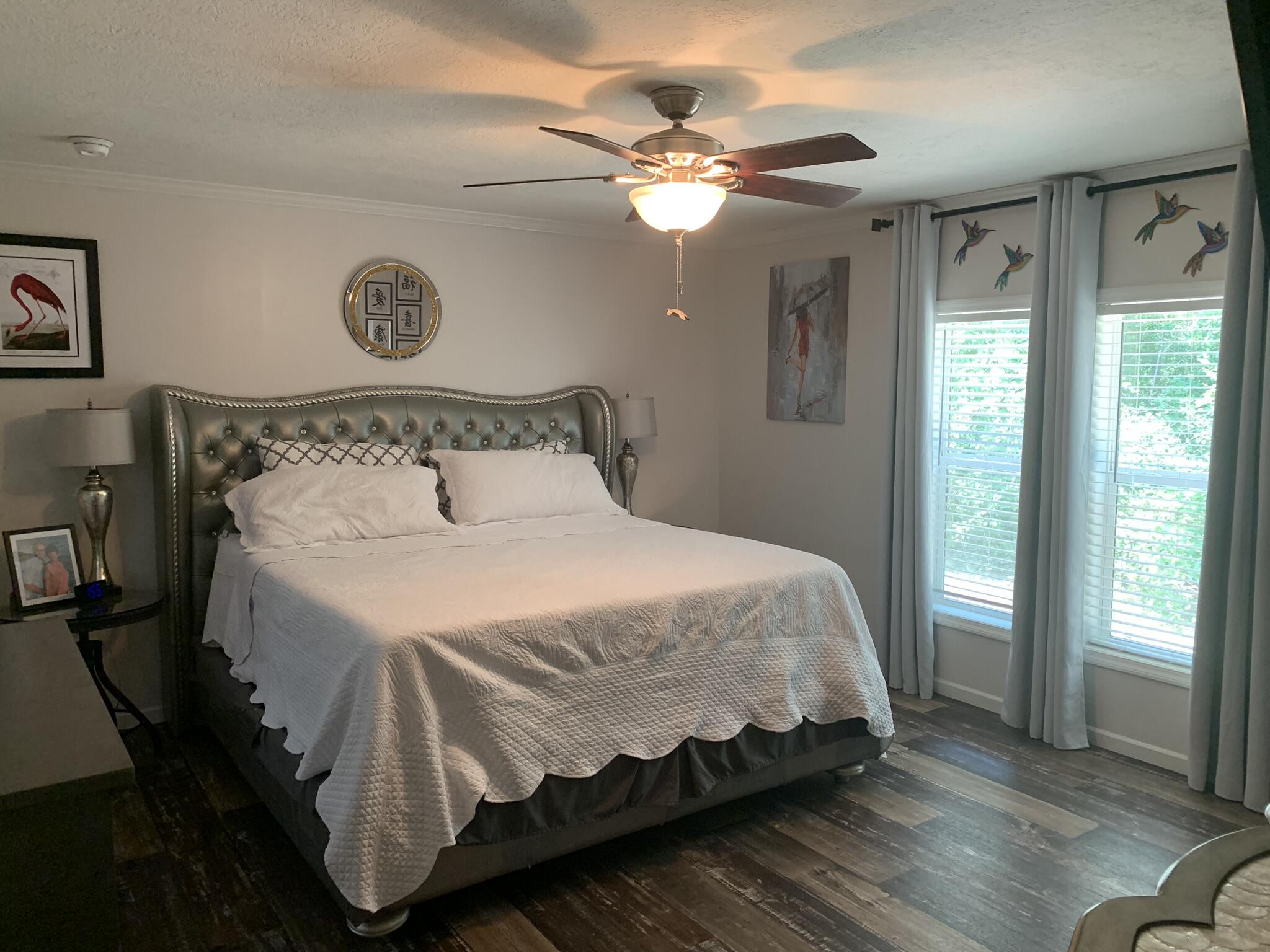 6196 Lake Ella Road Crestview, FL 32539 - Photo 17 of 29 a bedroom with a bed and window