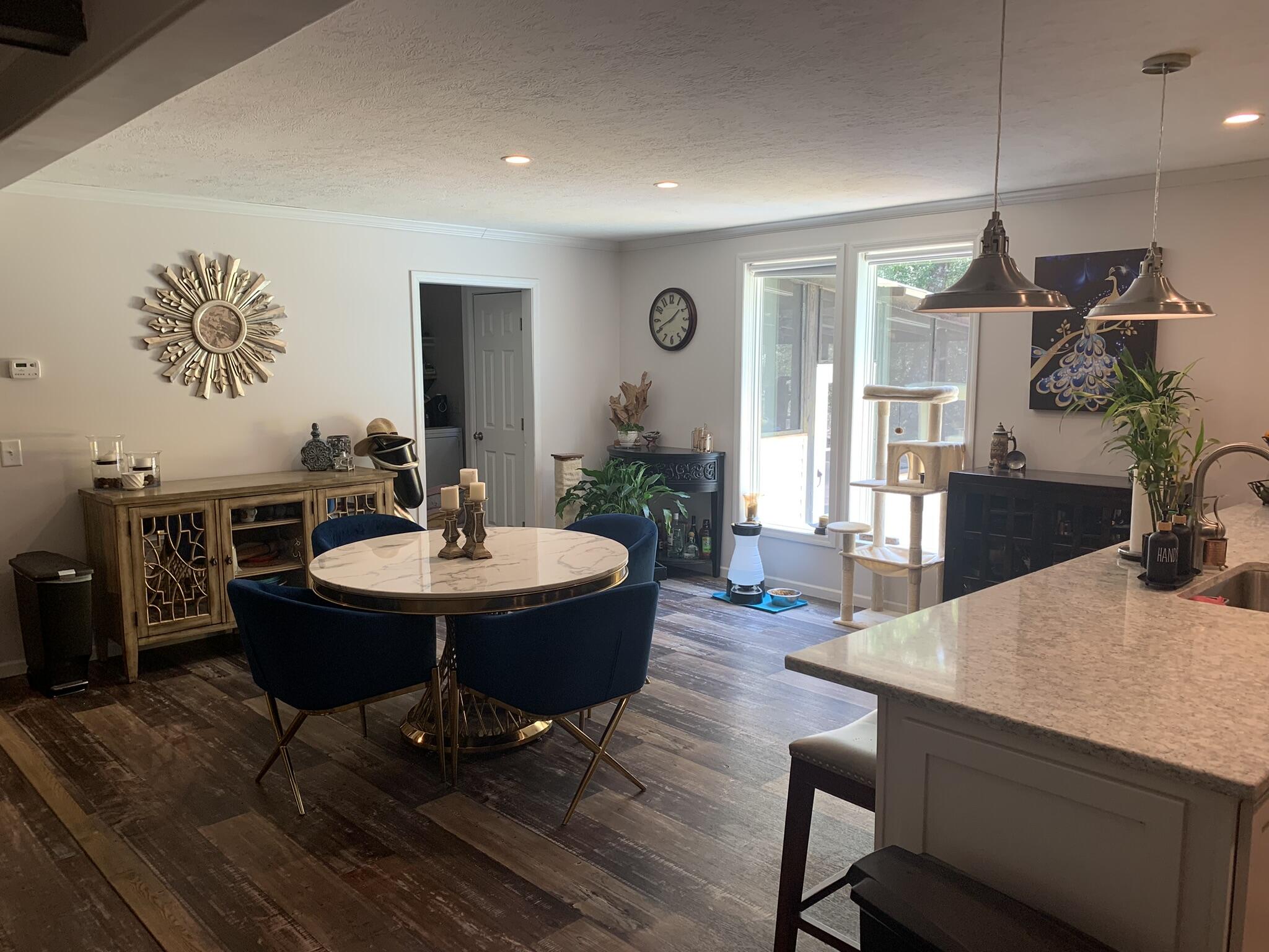 6196 Lake Ella Road Crestview, FL 32539 - Photo 7 of 29 a view of a dining room with furniture window and wooden floor