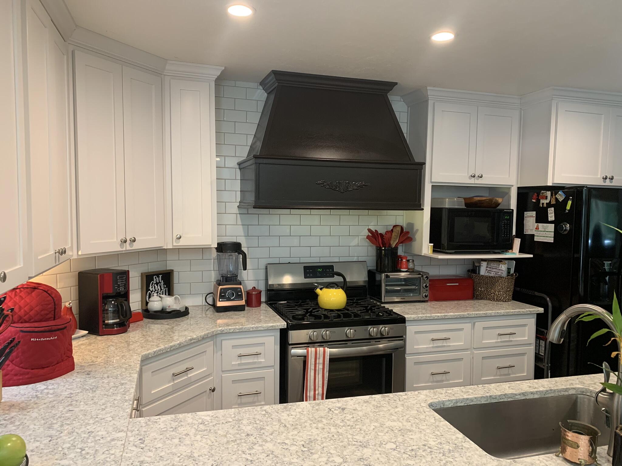 6196 Lake Ella Road Crestview, FL 32539 - Photo 9 of 29 a kitchen with a stove and a microwave