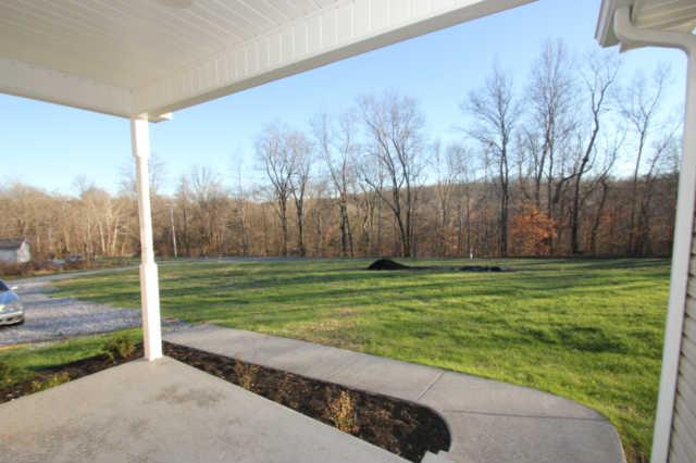 1202 St Paul Road Charlotte, TN 37036 - Photo 9 of 20 Covered Front Porch & Concrete Sidewalk