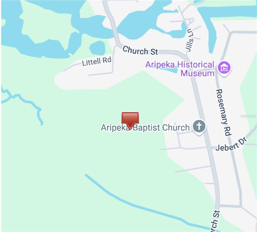 Aripeka Road Aripeka, FL 34679 - Photo 4 of 5 a picture of a book and a white bed