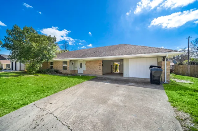 a front view of a house with a yard and porch