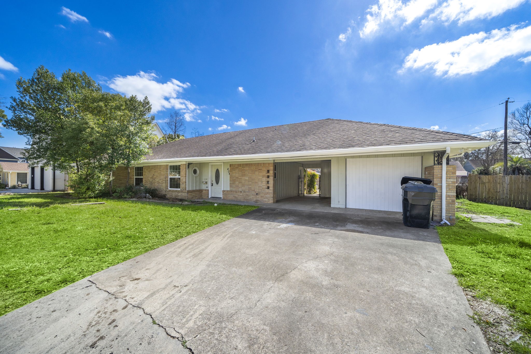 404 Milwaukee Street Houston, TX 77009 - Photo 1 of 19 a front view of a house with a yard and porch