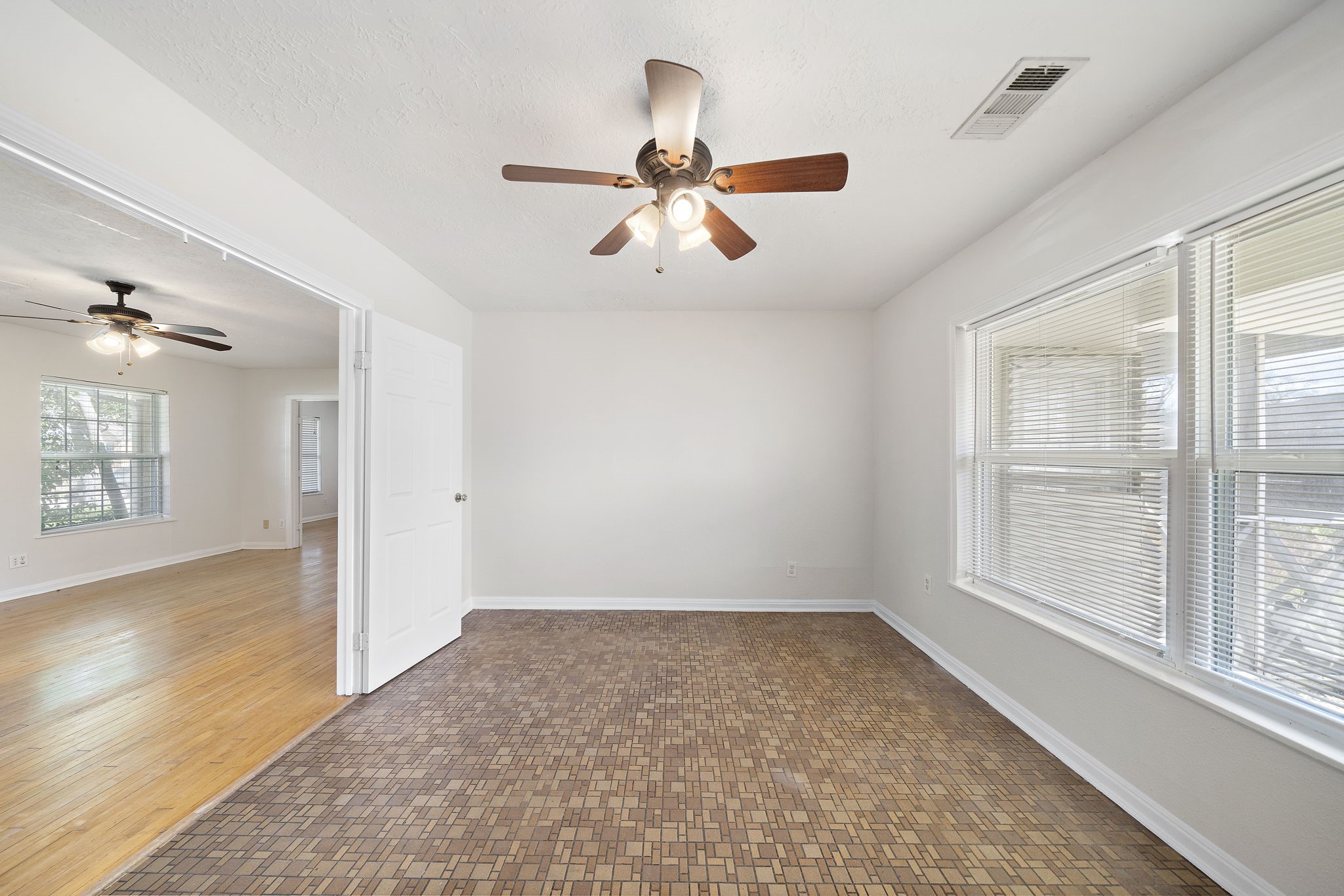404 Milwaukee Street Houston, TX 77009 - Photo 15 of 19 wooden floor in an empty room with a window