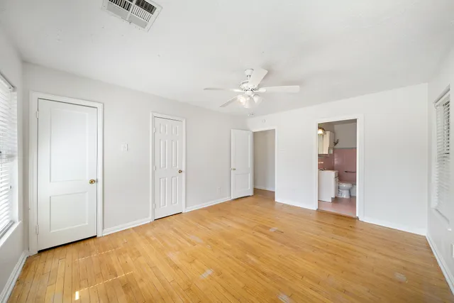a view of empty room with ceiling fan
