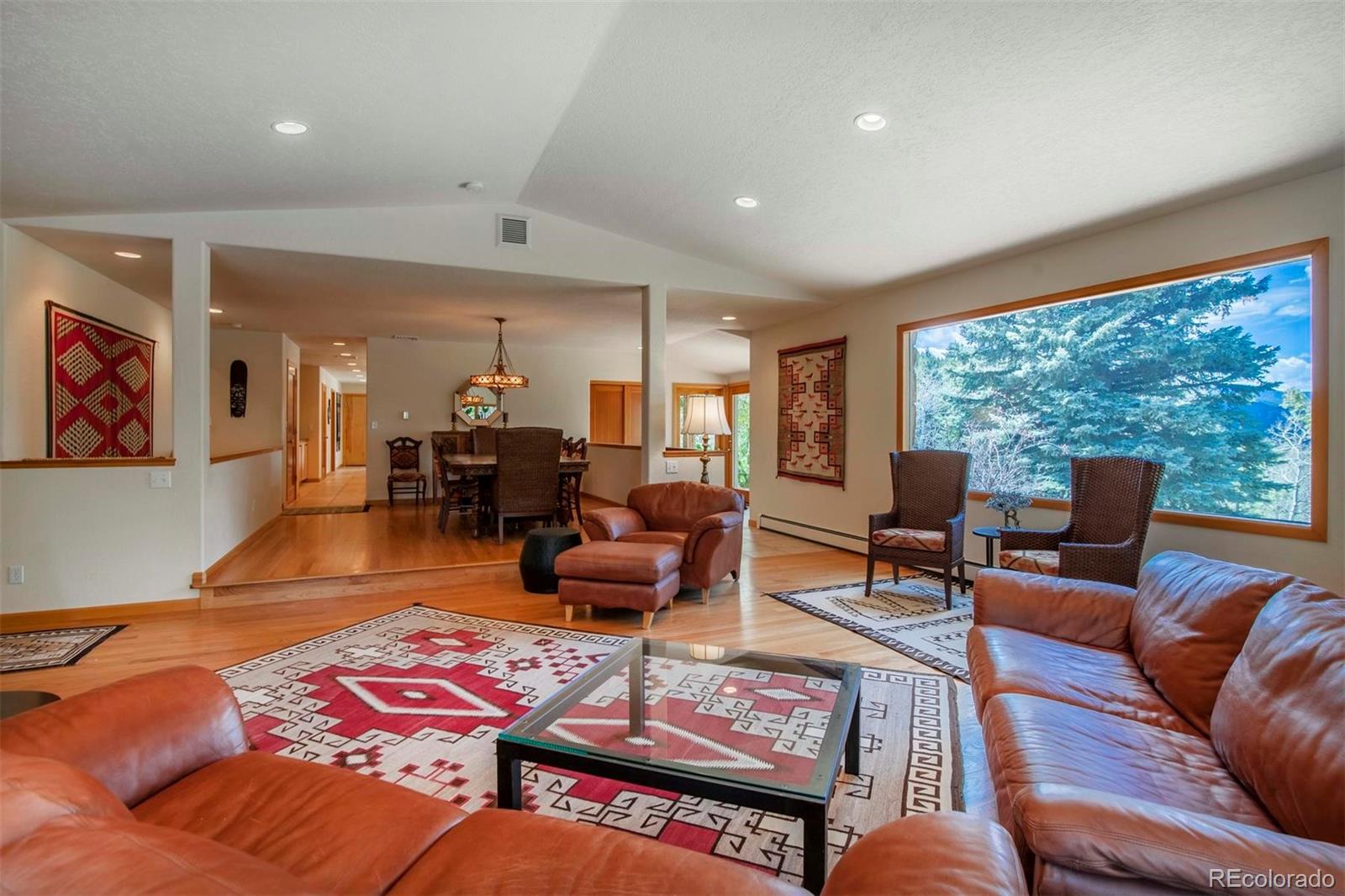 18332 Stone Gate Drive Morrison, CO 80465 - Photo 19 of 40 a living room with furniture and a large window