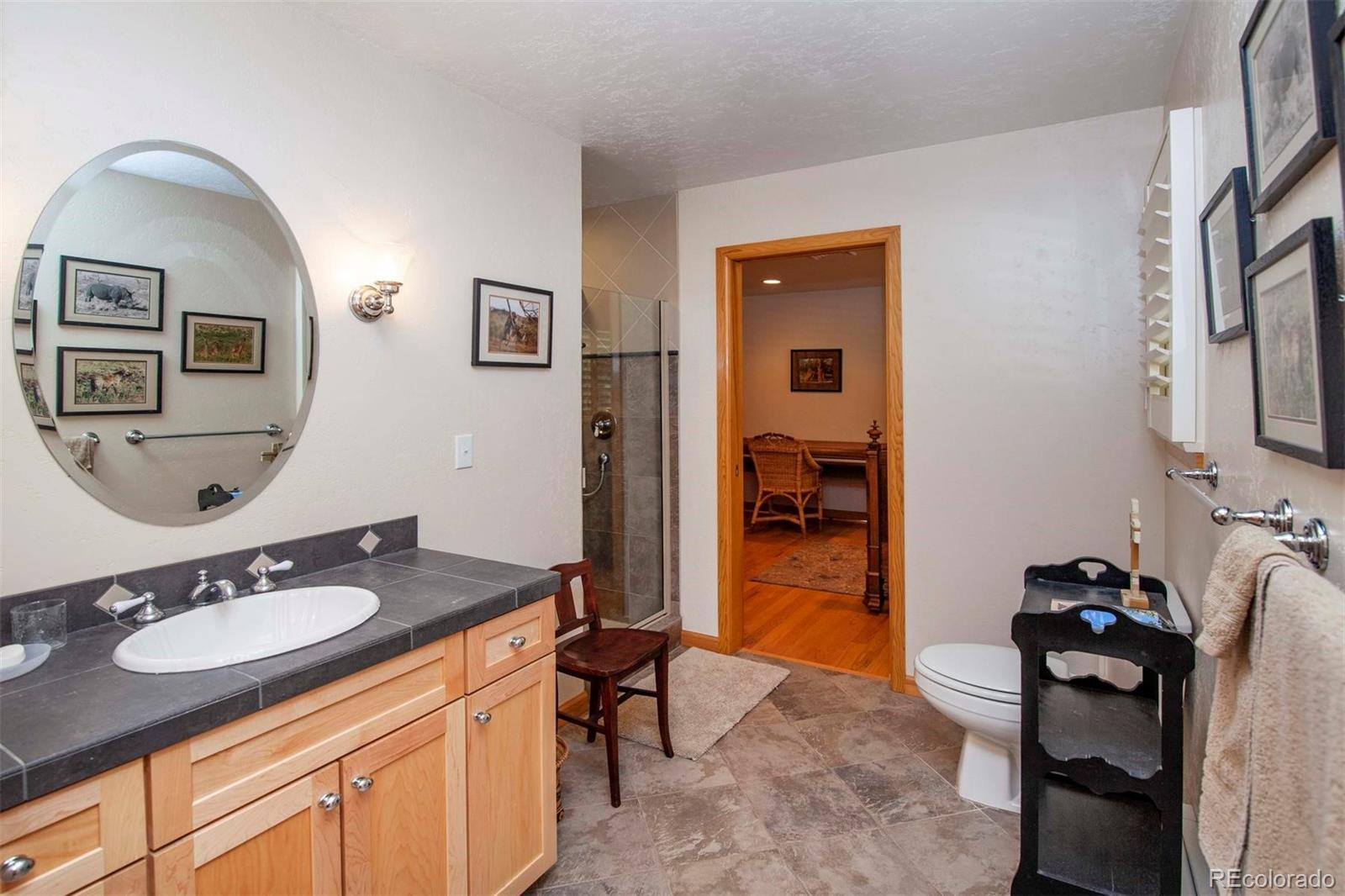 18332 Stone Gate Drive Morrison, CO 80465 - Photo 28 of 40 a bathroom with a sink double vanity