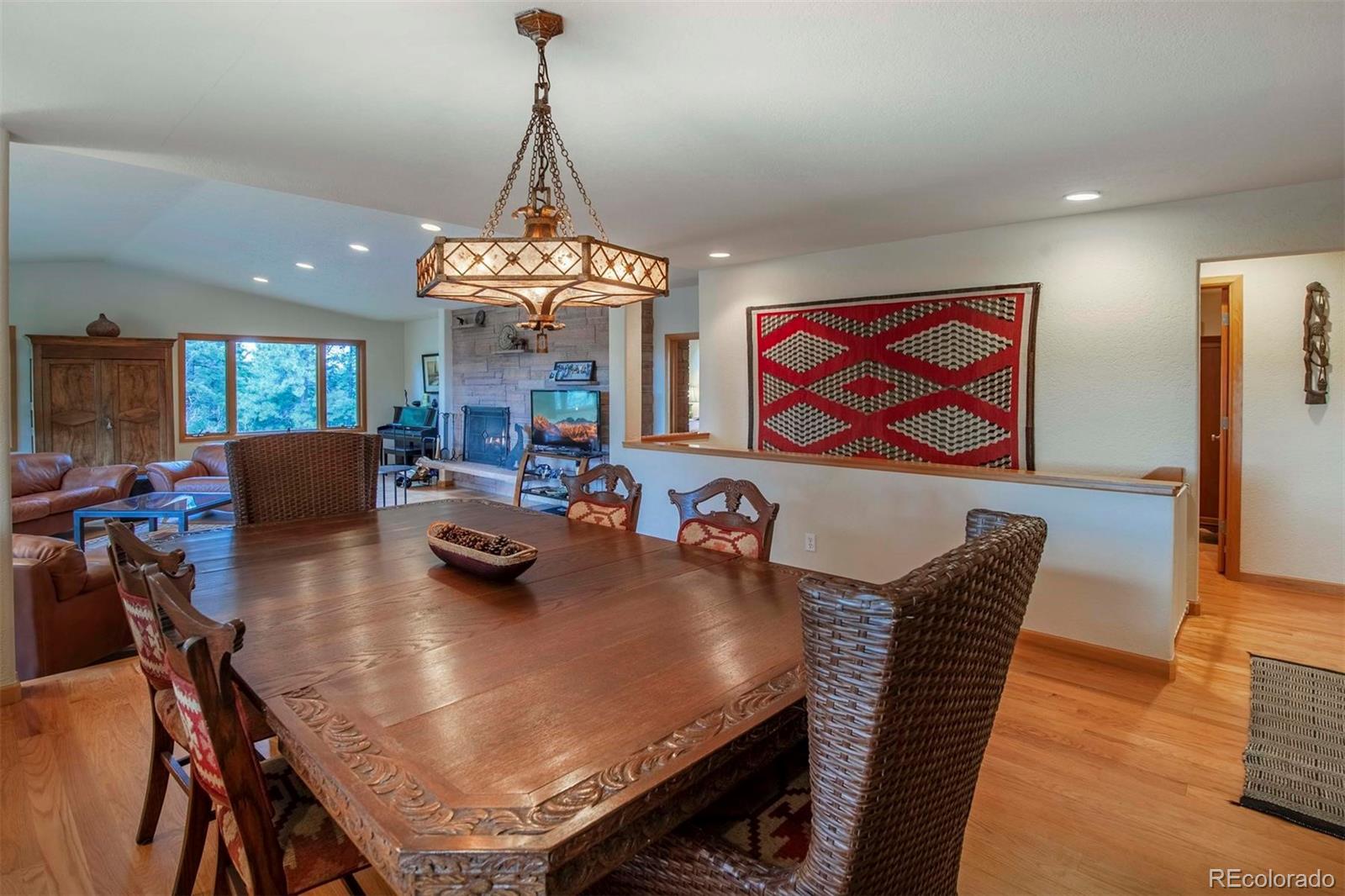 18332 Stone Gate Drive Morrison, CO 80465 - Photo 7 of 40 a view of a dining room with furniture