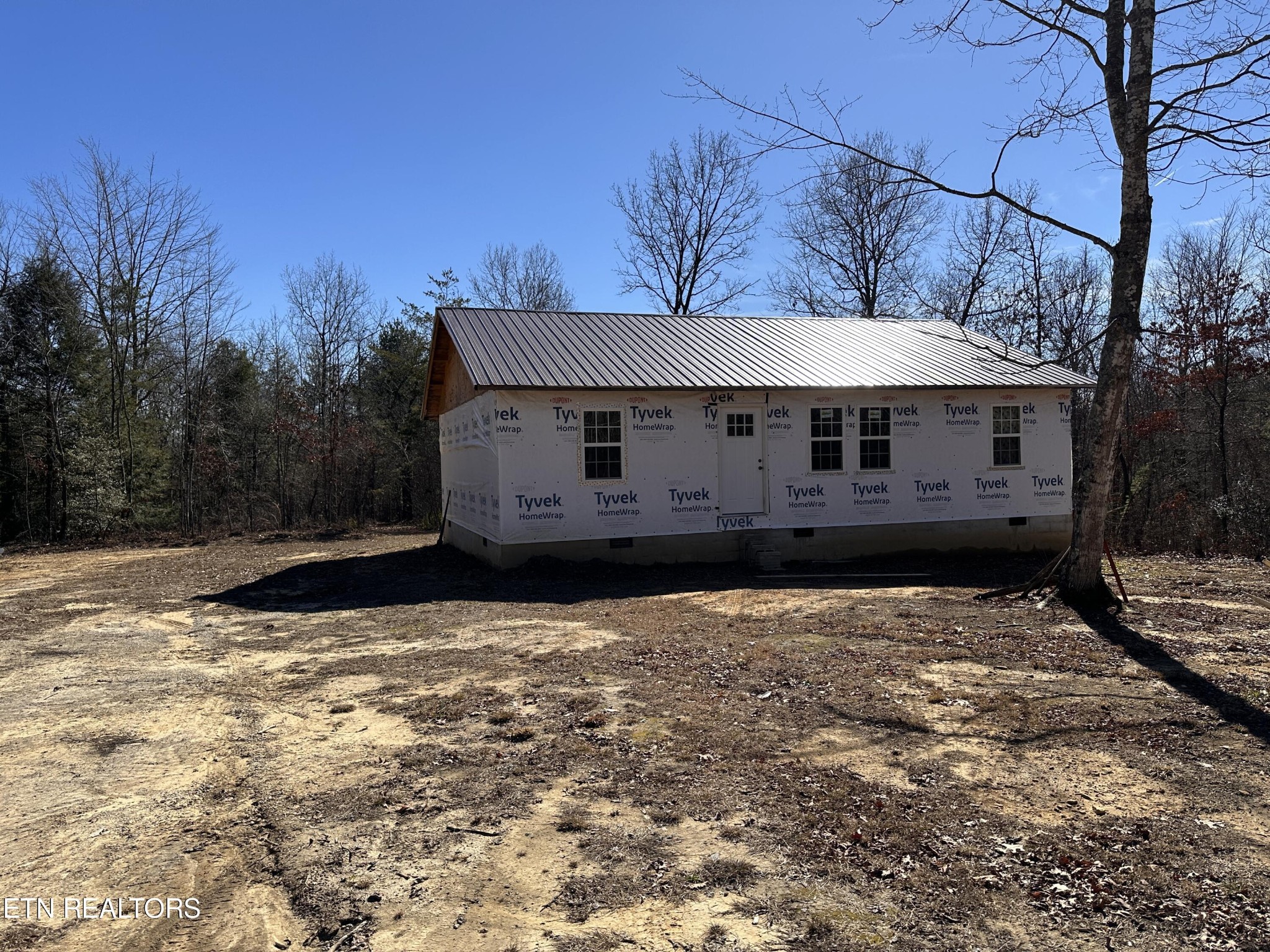 788 Remington Road Jamestown, TN 38556 - Photo 2 of 17 a view of a house with a snow in a yard