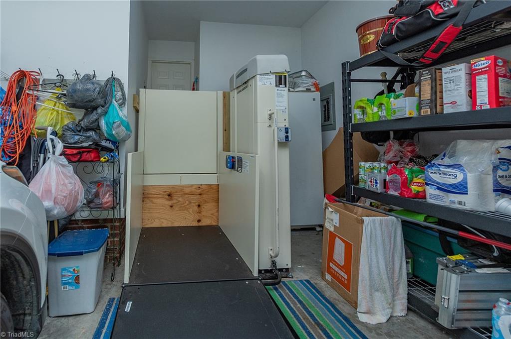 510 Aldridge Road Archdale, NC 27263 - Photo 39 of 50 The Wheelchair Lift in garage can be removed if Buyer does not want it. Stairs remain under lift.