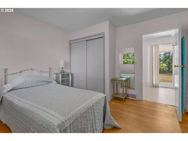 a bedroom with a bed and a table in it