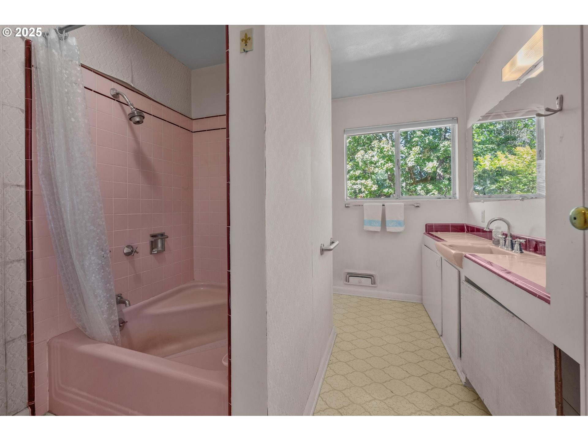 11990 Southwest Denney Road Beaverton, OR 97008 - Photo 19 of 40 a bathroom with a bathtub and a sink