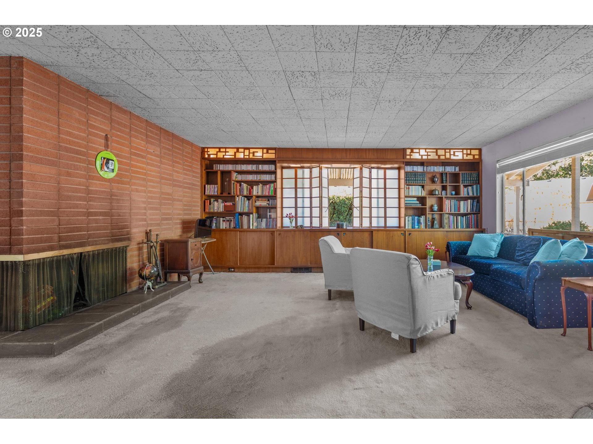 11990 Southwest Denney Road Beaverton, OR 97008 - Photo 5 of 40 a living room with furniture and a floor to ceiling window