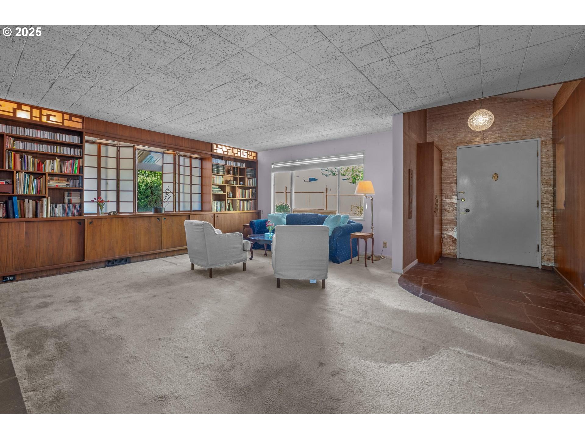 11990 Southwest Denney Road Beaverton, OR 97008 - Photo 6 of 40 a living room with furniture and large window