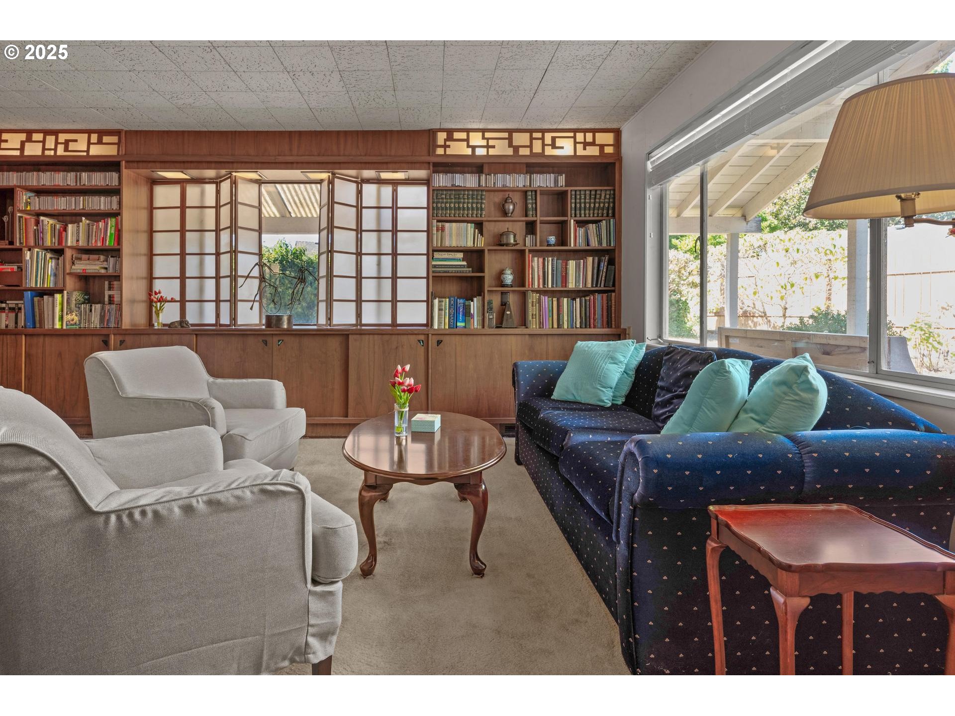 11990 Southwest Denney Road Beaverton, OR 97008 - Photo 7 of 40 a living room with furniture and a large window